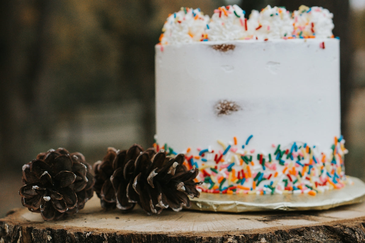 white and brown cake on brown wooden table