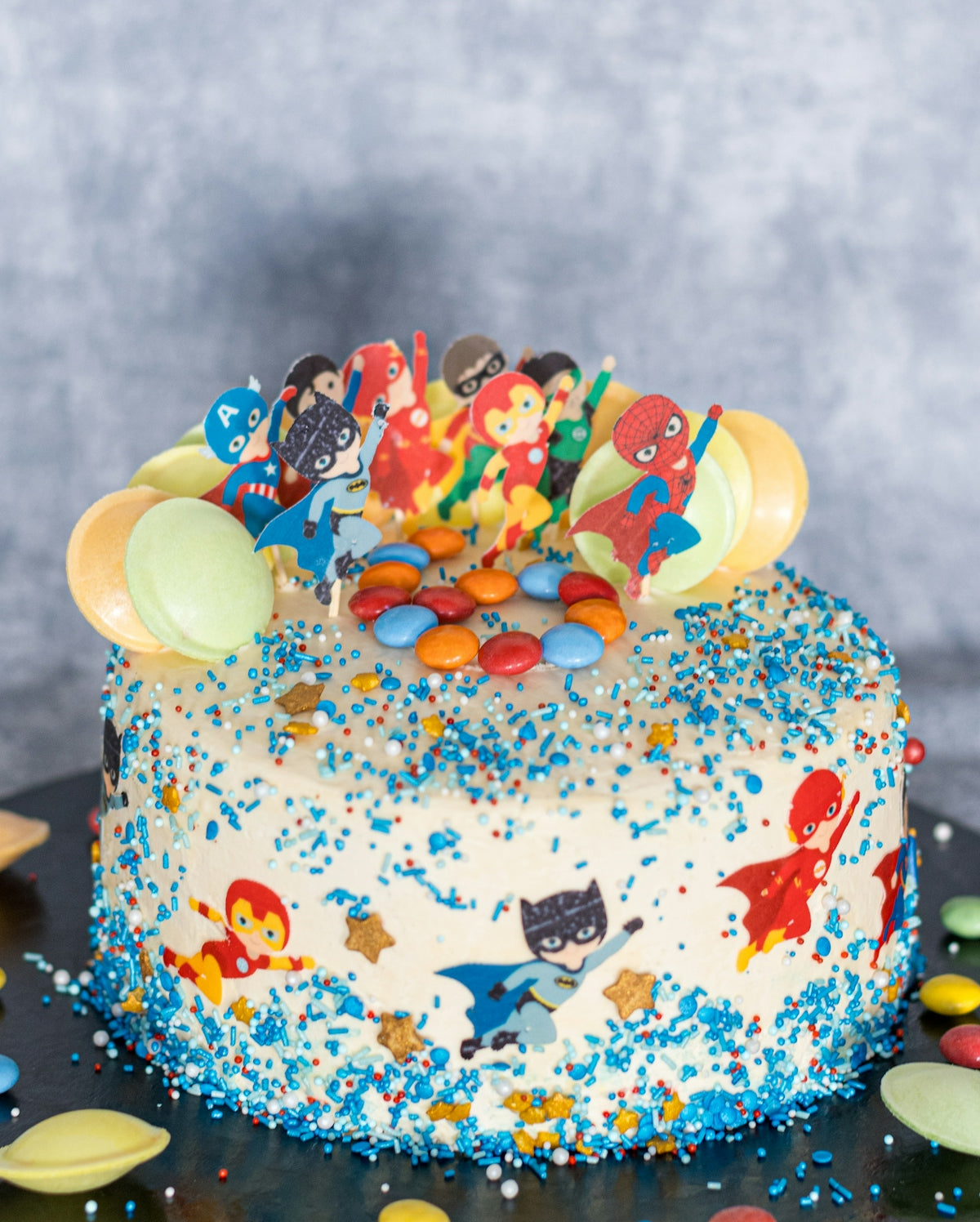a birthday cake with sprinkles and decorations