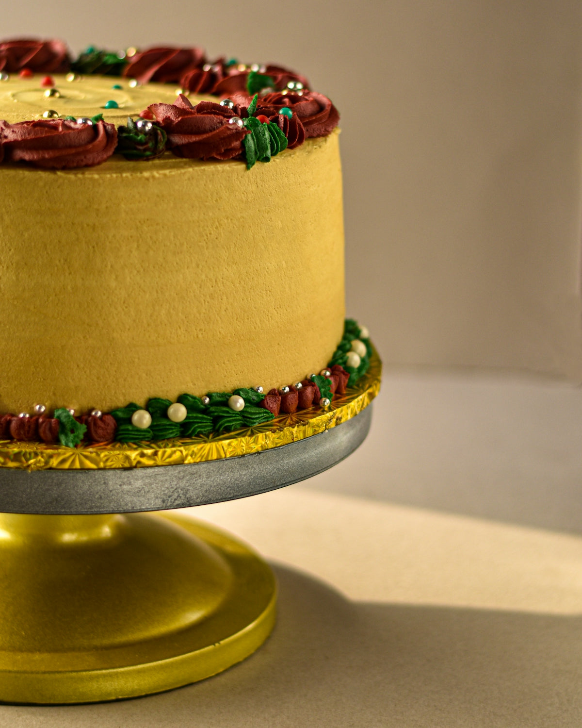 a decorated cake sitting on top of a cake plate