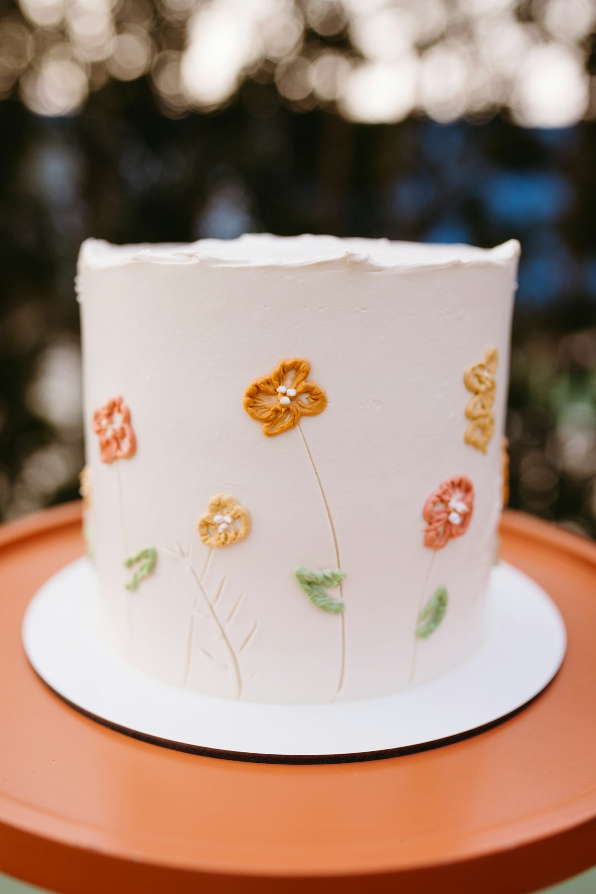 A decorated cake sitting on top of a table