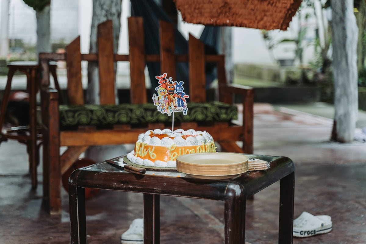 A decorated cake sits on a small table.