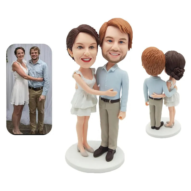 Personalised Couple embracing in pale blue shirt and short pale dress Figurines; example sculpture