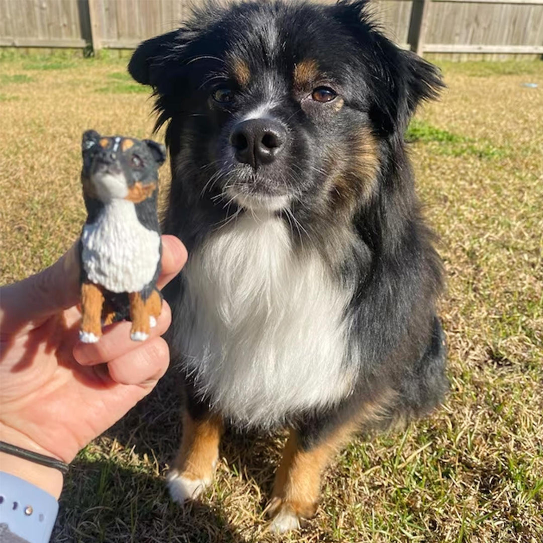 Handmade tricolour Australian Shepherd figurine beside the real dog
