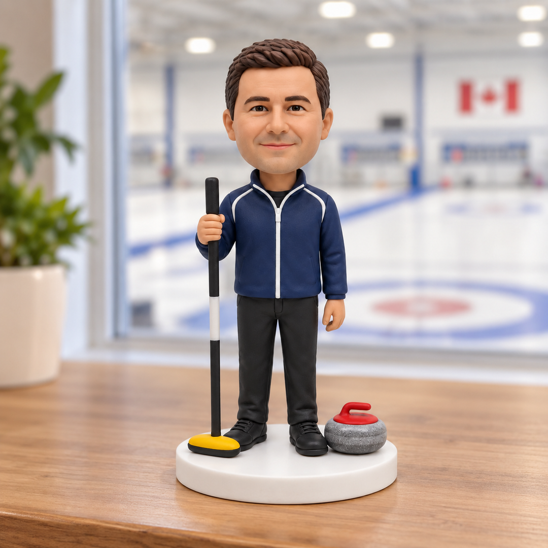 Custom curling player bobblehead on display near a curling rink