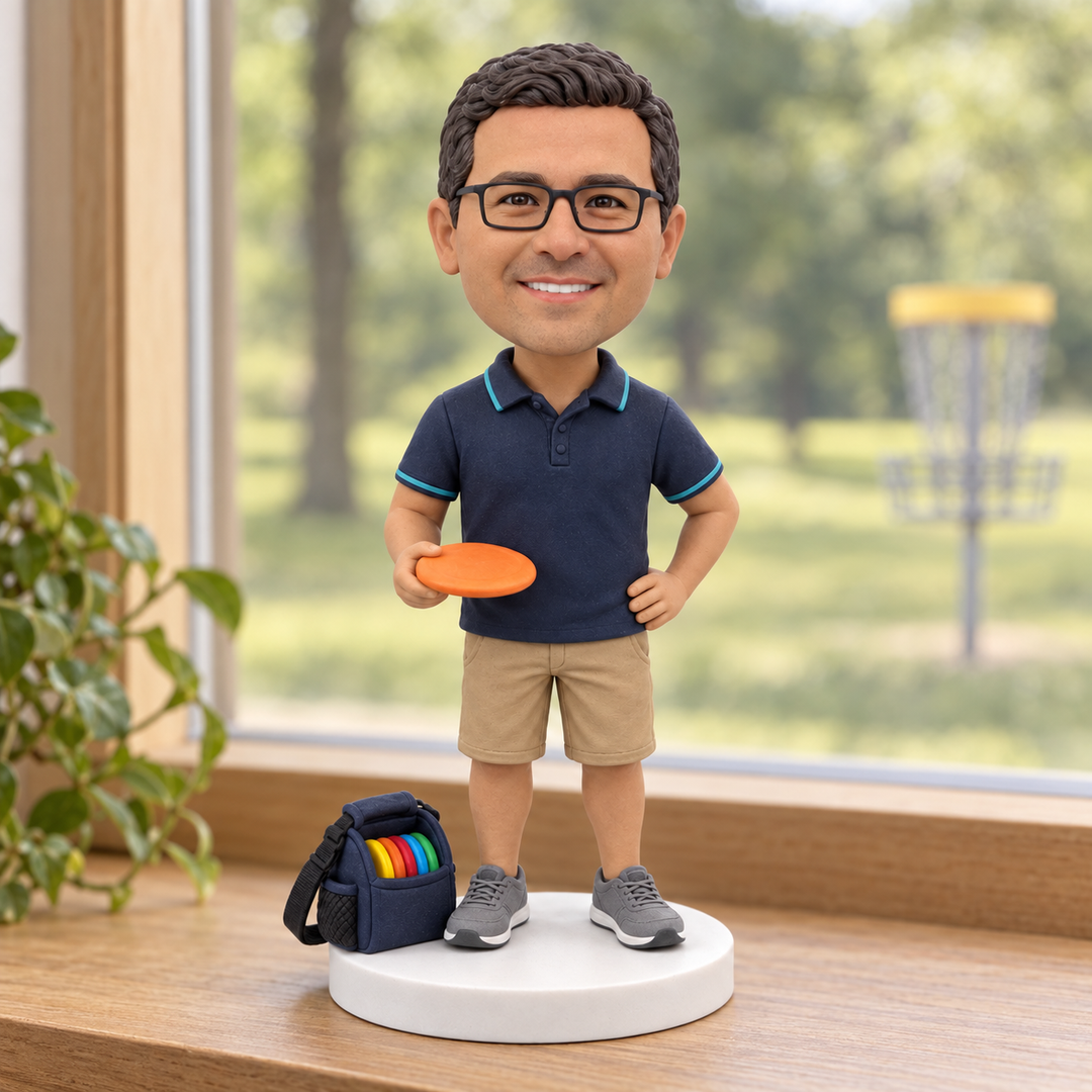 Custom disc golf bobblehead displayed near course