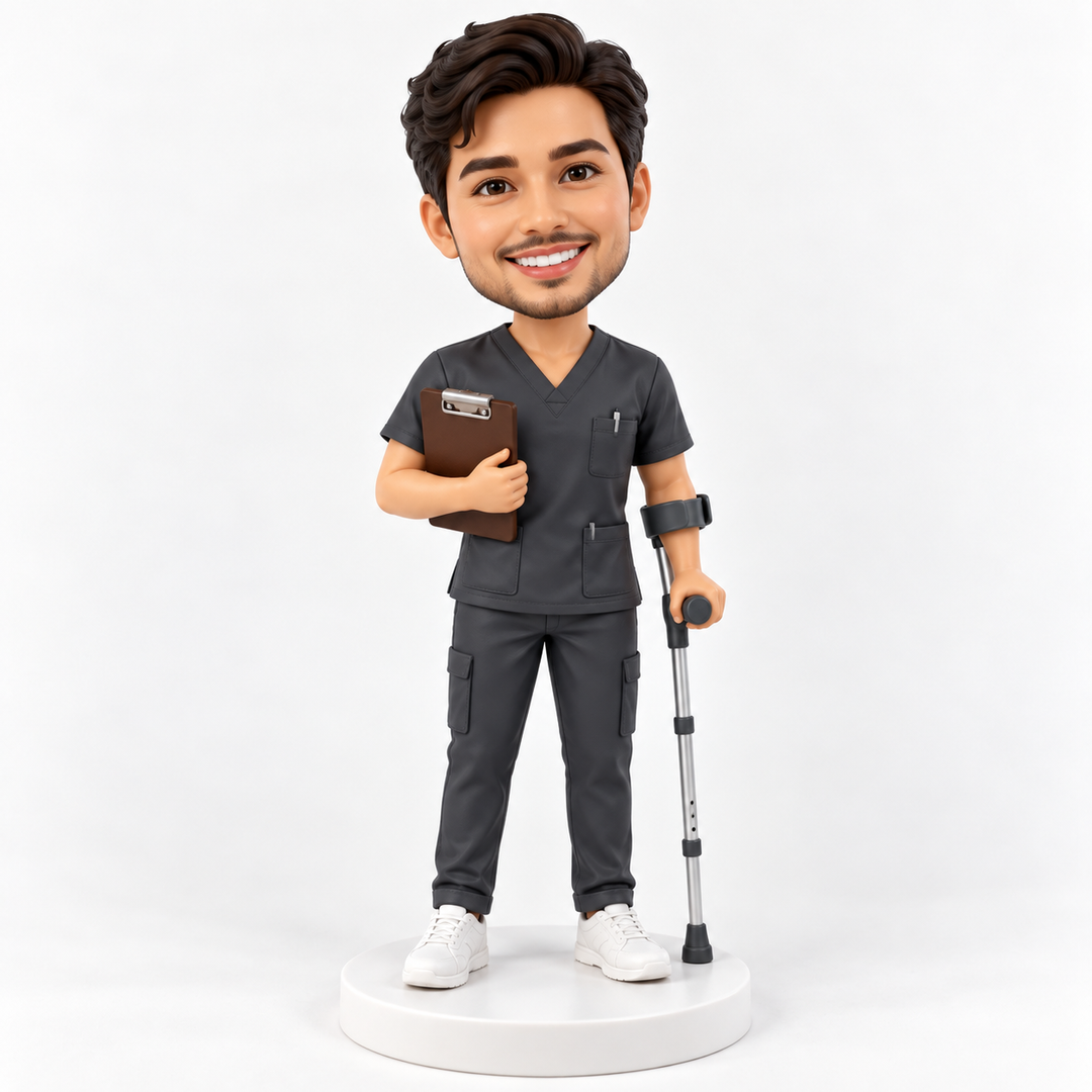 Personalised physiotherapist bobblehead in charcoal scrubs with a clipboard and forearm crutch on a plain white display base.