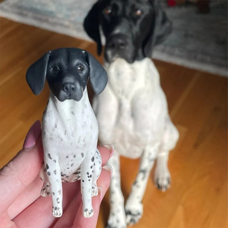 German Shorthaired Pointer beside its hand-sized custom clay figurine, from CakeTopperDesignGift.